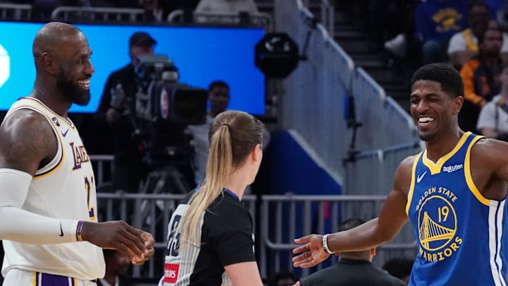 Feb 28, 2026; San Francisco, California, USA;  Los Angeles Lakers forward LeBron James (23) laughs with Golden State Warriors guard Nate Williams (19) during a break in the third quarter at Chase Center. Mandatory Credit: David Gonzales-Imagn Images