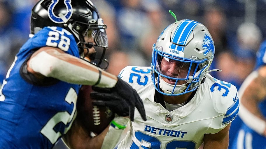 Indianapolis Colts running back Jonathan Taylor (28) runs against Detroit Lions safety Brian Branch (32)  | Junfu Han / USA TODAY NETWORK via Imagn Images