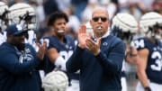 Penn State coach James Franklin leads the Nittany Lions through wamups at the 2022 Blue-White Game at Beaver Stadium.