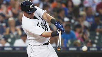 Former Detroit Tigers catcher James McCann (34) hits a single in the seventh inning against the Minnesota Twins at Comerica Park.