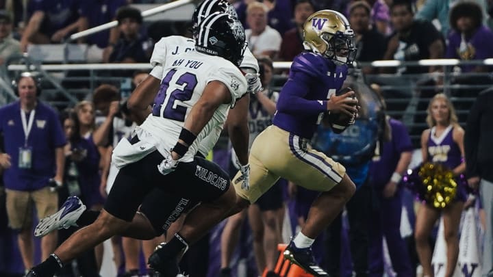 Demond Williams Jr. rushed for 9 yards on his first Husky play.