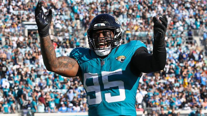 Nov 16, 2025; Jacksonville, Florida, USA; Jacksonville Jaguars defensive end BJ Green II (95) celebrates an interception by teammate against the Los Angeles Chargers during the fourth quarter at EverBank Stadium. Mandatory Credit: Morgan Tencza-Imagn Images