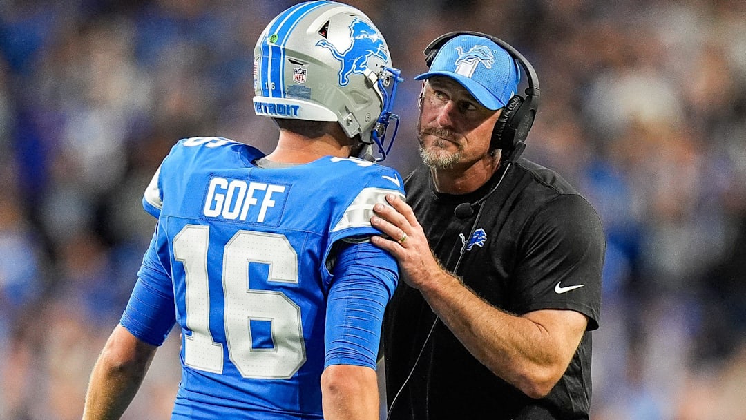 Detroit Lions quarterback Jared Goff (16) talks to head coach Dan Campbell at a timeout against the Los Angeles Rams during the first half at Ford Field in Detroit on Sunday, September 8, 2024.
