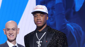 Jun 25, 2025; Brooklyn, NY, USA;  Thomas Sorber stands with NBA commissioner Adam Silver after being selected as the 15th pick by the Oklahoma City Thunder in the first round of the 2025 NBA Draft at Barclays Center. Mandatory Credit: Brad Penner-Imagn Images