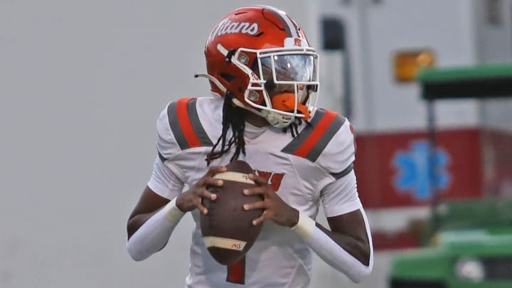 University High quarterback Malachi Walters (1) tossed a game-winning touchdown pass with just 46 seconds remaining to lift the Titans to a thrilling 31-28 victory over Mainland to start the 2024 Florida high school football season.