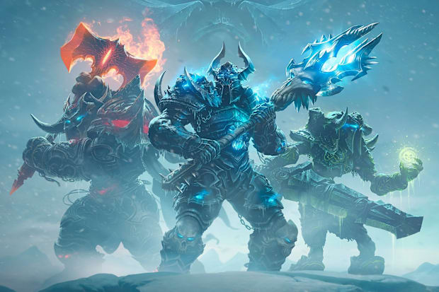 World of Warcraft death knights stand in an icy storm ready to fight.