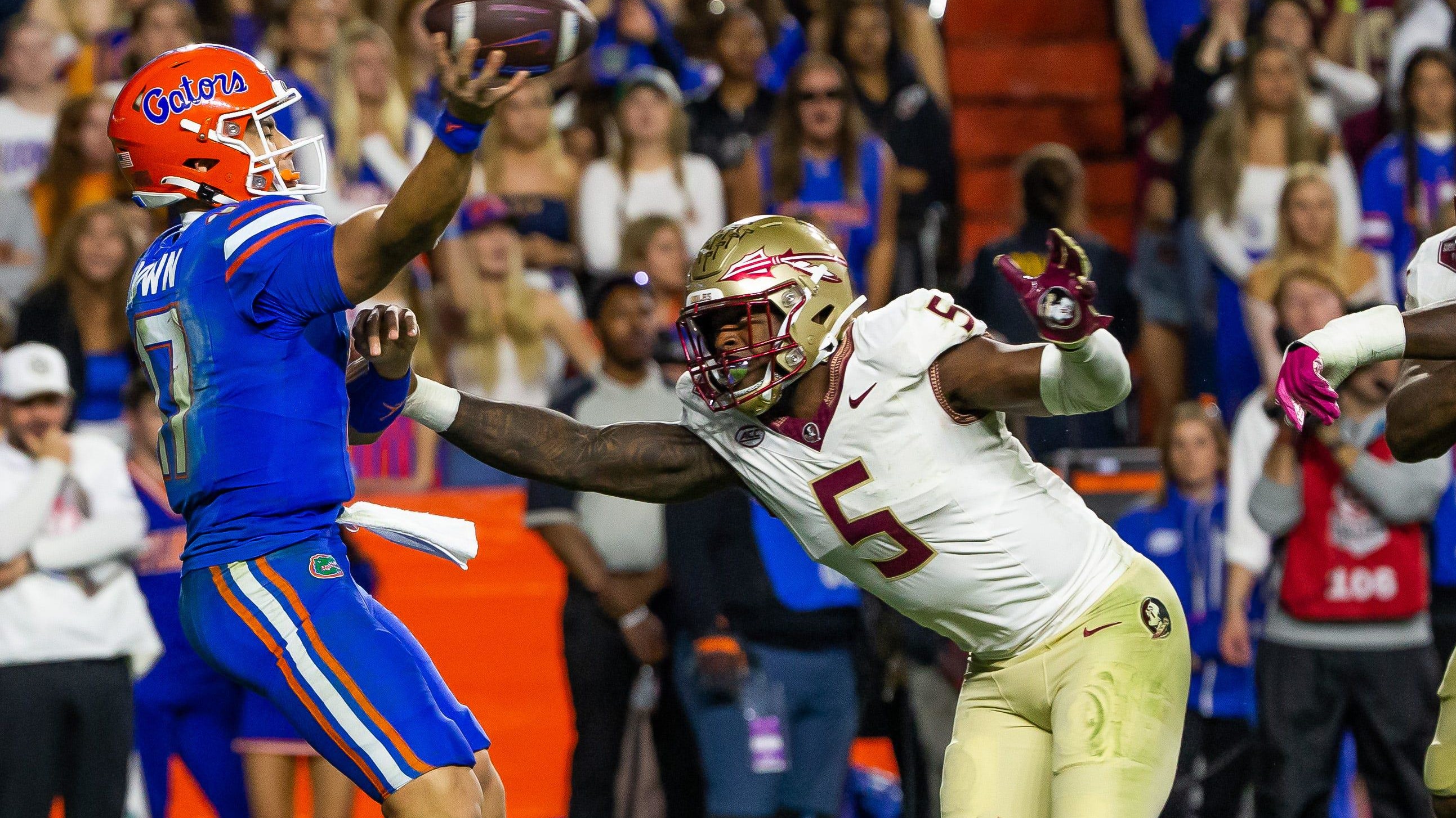 Florida State edge rusher Jared Verse pursues Florida quarterback Max Brown