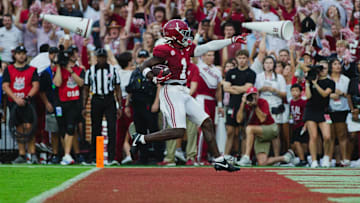 Aug 31, 2024; Tuscaloosa, Alabama, USA; Alabama Crimson Tide wide receiver Kendrick Law (1) scores a touchdown against the Western Kentucky Hilltoppers during the first quarter at Bryant-Denny Stadium. Mandatory Credit: Will McLelland-Imagn Images