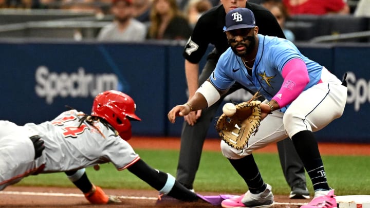 Tampa Bay Rays first baseman Yandy Diaz (right) waits for the ball on a pickoff attempt on Sunday at Tropicana Field.