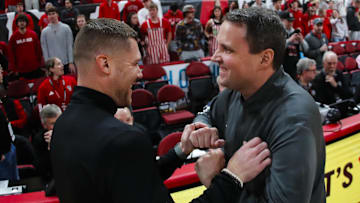 Dec 6, 2025; Raleigh, North Carolina, USA; UNC Asheville Bulldogs head coach Mike Morrell meets with NC State Wolfpack head coach Will Wade before the first half of the game at Lenovo Center. Mandatory Credit: Jaylynn Nash-Imagn Images