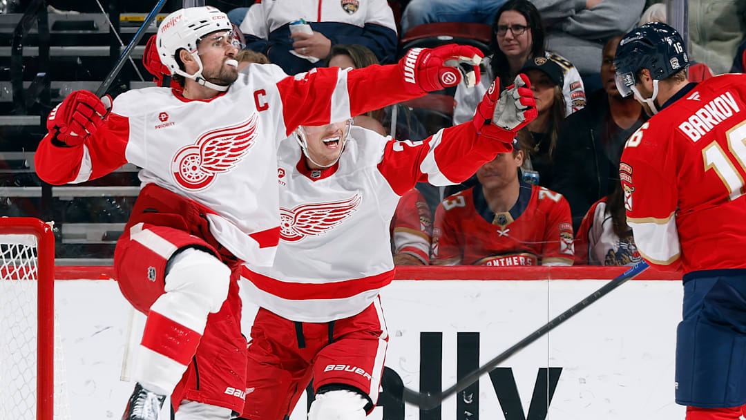 Dylan Larkin celebrate as the Detroit Red Wings score against the Florida Panthers.