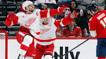 Dylan Larkin celebrate as the Detroit Red Wings score against the Florida Panthers.