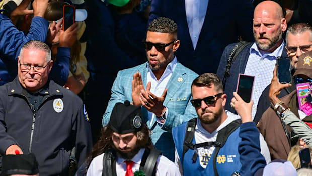 Marcus Freeman walks out of mass on his way to Notre Dame's home opener in 2024. 