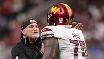 Washington Commanders head coach Dan Quinn and offensive lineman Chris Paul. 