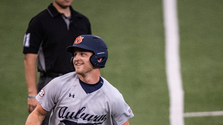 Auburn Tigers catcher Ike Irish (18) runs from third base to home to score a run for the Tigers in the third inning as the Texas Longhorns take on the Auburn in the first game of a three-game series on Thursday night at UFCU Disch-Falk Field in Austin, April 17, 2025.