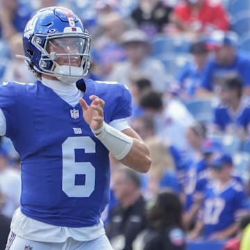 New York Giants QB Jaxson Dart warms up prior to the game against the Buffalo Bills at Highmark Stadium.