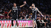 Mar 6, 2025; Brooklyn, New York, USA;  Brooklyn Nets forward Ziaire Williams (8) and guard Tyrese Martin (13) celebrate during a timeout in the first quarter against the Golden State Warriors at Barclays Center. Mandatory Credit: Wendell Cruz-Imagn Images