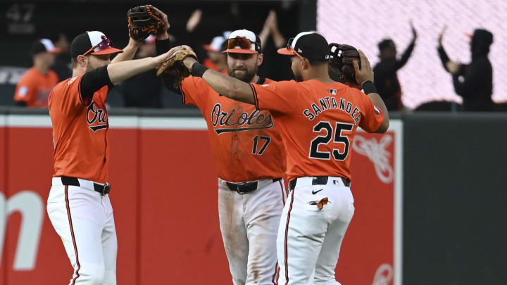 Aug 24, 2024; Baltimore, Maryland, USA;  Baltimore Orioles celebrates on the field after defeating against the Houston Astros at Oriole Park at Camden Yards.