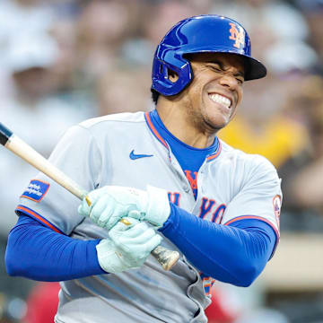 Jul 29, 2025; San Diego, California, USA; New York Mets right fielder Juan Soto (22) reacts after fouling off a ball off his lower extremity during the fourth inning against the San Diego Padres at Petco Park. Mandatory Credit: David Frerker-Imagn Images