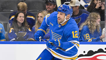 Oct 2, 2025; St. Louis, Missouri, USA; St. Louis Blues left wing Milan Lucic (12) skates against the Ottawa Senators during the second period at Enterprise Center. Mandatory Credit: Jeff Curry-Imagn Images