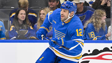Oct 2, 2025; St. Louis, Missouri, USA; St. Louis Blues left wing Milan Lucic (12) skates against the Ottawa Senators during the second period at Enterprise Center. Mandatory Credit: Jeff Curry-Imagn Images