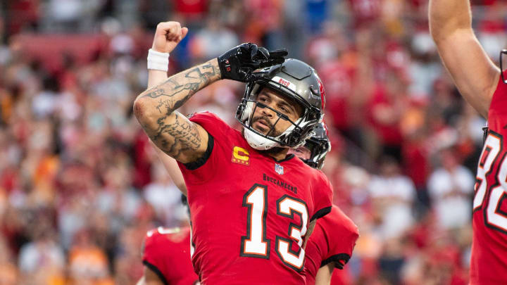 Dec 24, 2023; Tampa, Florida, USA; Tampa Bay Buccaneers wide receiver Mike Evans (13) celebrates the touchdown against the Jacksonville Jaguars in the second quarter at Raymond James Stadium. Mandatory Credit: Jeremy Reper-USA TODAY Sports