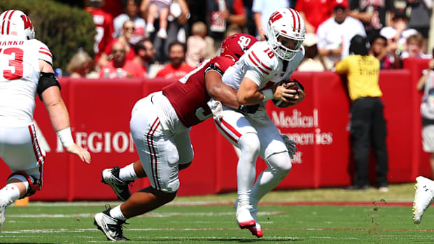 Wisconsin Badgers quarterback Danny O'Neil (18) is sacked