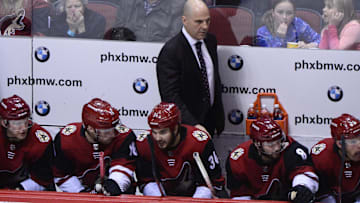 Feb 10, 2018; Glendale, AZ, USA; Arizona Coyotes head coach Rick Tocchet looks on during the second period against the Philadelphia Flyers at Gila River Arena. Mandatory Credit: Matt Kartozian-Imagn Images