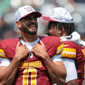 Aug 10, 2024; East Rutherford, New Jersey, USA; Washington Commanders quarterback Marcus Mariota (0) looks on during the first half against the New York Jets at MetLife Stadium. Mandatory Credit: Vincent Carchietta-Imagn Images