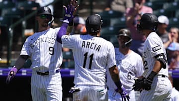 Jul 3, 2025; Denver, Colorado, USA; Colorado Rockies shortstop Orlando Arcia (11) scores a run in the fourth inning against the Houston Astros at Coors Field