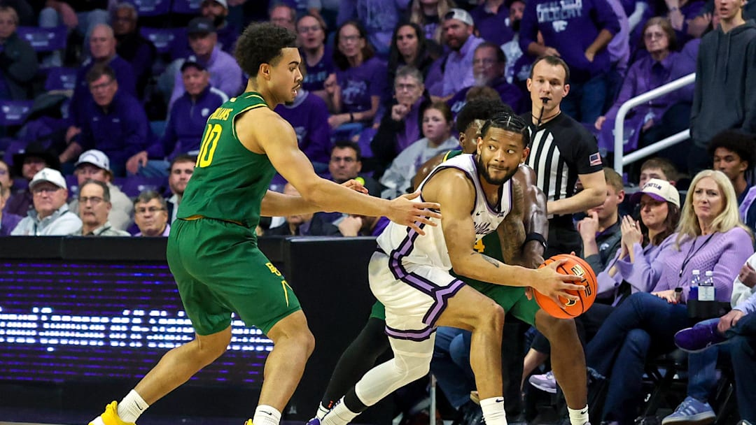 Feb 17, 2026; Manhattan, Kansas, USA; Kansas State Wildcats guard David Castillo (10) is guarded by Baylor Bears guards Isaac Williams IV (10) and Tounde Yessoufou (24) during the second half at Bramlage Coliseum. Mandatory Credit: Scott Sewell-Imagn Images