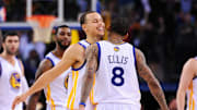 January 21, 2011; Oakland, CA, USA; Golden State Warriors point guard Stephen Curry (center, facing) celebrates with shooting guard Monta Ellis (8) as Sacramento Kings small forward Donte Greene (far left) walks off the court during a timeout in the fourth quarter at ORACLE Arena. The Warriors defeated the Kings 119-112. Mandatory Credit: Kyle Terada-Imagn Images