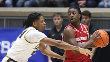 Purdue Boilermakers guard Gicarri Harris (24) defends Wisconsin Badgers guard John Blackwell (25) Saturday, Feb. 15, 2025, during the NCAA men’s basketball game at Mackey Arena in West Lafayette, Ind. Wisconsin Badgers won 94-84.