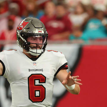 Aug 23, 2024; Tampa, Florida, USA;  Tampa Bay Buccaneer quarterback Baker Mayfield (6) throws the ball against the Miami Dolphins during the first quarter at Raymond James Stadium. Mandatory Credit: Kim Klement Neitzel-Imagn Images