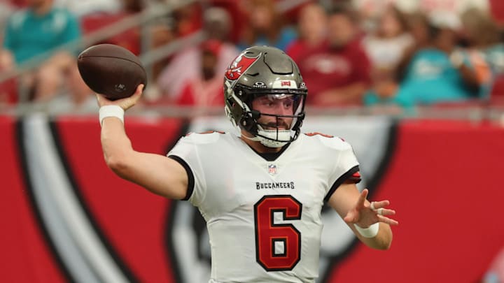 Aug 23, 2024; Tampa, Florida, USA;  Tampa Bay Buccaneer quarterback Baker Mayfield (6) throws the ball against the Miami Dolphins during the first quarter at Raymond James Stadium. Mandatory Credit: Kim Klement Neitzel-Imagn Images