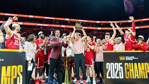 Nebraska coach Fred Hoiberg holds up the College Basketball Crown trophy after the Huskers beat UCF in the championship game.