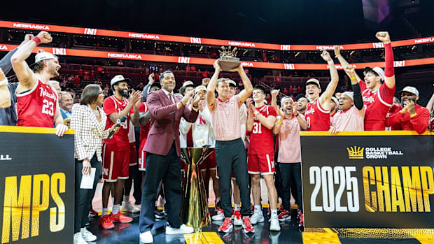 Nebraska coach Fred Hoiberg holds up the College Basketball Crown trophy after the Huskers beat UCF in the championship game.