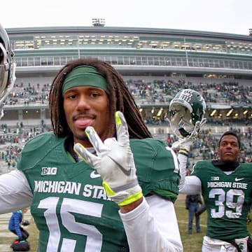 Nov 22, 2014; East Lansing, MI, USA; Michigan State Spartans cornerback Trae Waynes (15) celebrates a win after a game at Spartan Stadium. Mandatory Credit: Mike Carter-Imagn Images