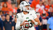 Aug 31, 2024; Syracuse, New York, USA; Ohio Bobcats quarterback Parker Navarro (13) drops back to pass against the Syracuse Orange during the second half at the JMA Wireless Dome. Mandatory Credit: Rich Barnes-Imagn Images