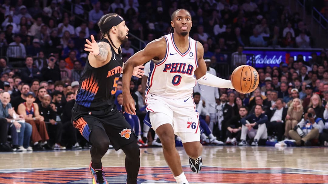 May 6, 2026; New York, New York, USA; Philadelphia 76ers guard Tyrese Maxey (0) drives past New York Knicks guard Jose Alvarado (5) during game five of the second round of the 2026 NBA Playoffs at Madison Square Garden. Mandatory Credit: Wendell Cruz-Imagn Images