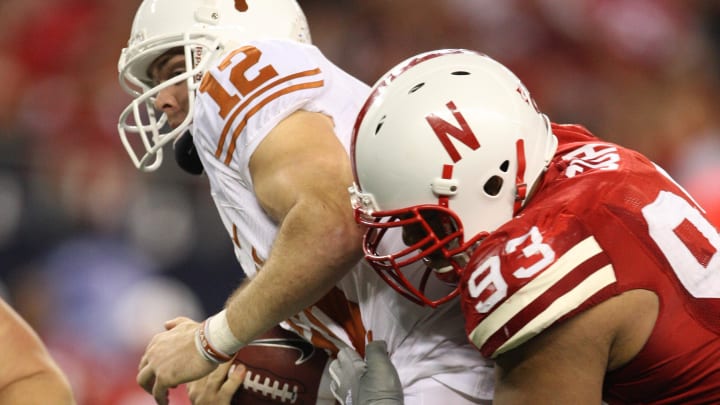 Dec 5, 2009; Arlington, TX, USA; Texas Longhorns quarterback Colt McCoy (12) gets sacked by Nebraska Cornhuskers defensive tackle Ndamukong Suh (93) during the Big 12 championship game at Cowboys Stadium. The Longhorns beat the Cornhuskers 13-12.