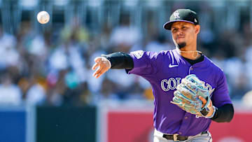 San Diego, California, USA; Colorado Rockies shortstop Ezequiel Tovar (14) throws to first base to complete the double play during the eighth inning against the San Diego Padres at Petco Park.