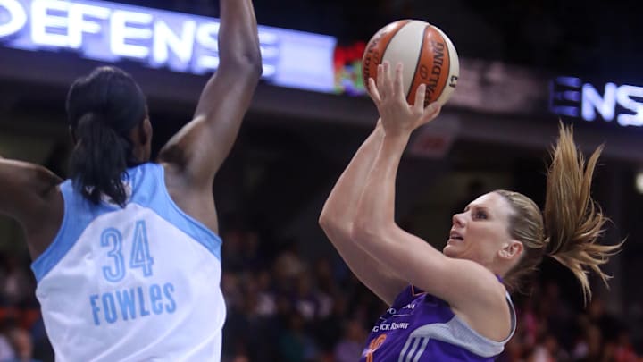 Sep 12, 2014; Chicago, IL, USA; Phoenix Mercury forward Penny Taylor (13) shoots over Chicago Sky center Sylvia Fowles (34) during the first quarter in game three of the 2014 WNBA Finals at UIC Pavilion. Mandatory Credit: Jerry Lai-Imagn Images