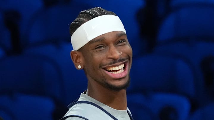 Dec 12, 2025; Las Vegas, NV, USA; Oklahoma City Thunder guard Luguentz Dort (5), guard Shai Gilgeous-Alexander (2) and center Isaiah Hartenstein (55) react during practice prior to the Emirates Cup semifinals at T-Mobile Arena. Mandatory Credit: Kirby Lee-Imagn Images