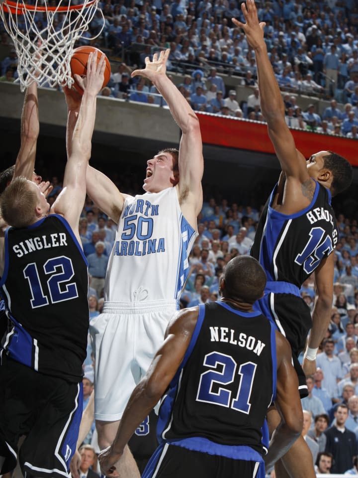 Feb 6, 2008, Chapel Hill, NC, USA; North Carolina Tar Heels forward Tyler Hansbrough (50) shoots as Duke Blue Devils forwards Kyle Singler (12) and Gerald Henderson (15) and guard DeMarcus Nelson (21) defend in the Blue Devils 89-78 victory against the Tar Heels at the Dean E. Smith Center. Mandatory Credit: Bob Donnan-USA TODAY Sports