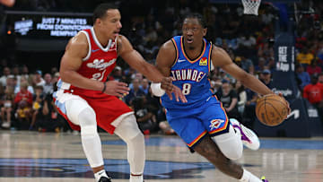 Apr 26, 2025; Memphis, Tennessee, USA; Oklahoma City Thunder forward Jalen Williams (8) dribbles as Memphis Grizzlies guard Desmond Bane (22) defends during the fourth quarter during game four for the first round of the 2024 NBA Playoffs at FedExForum. Mandatory Credit: Petre Thomas-Imagn Images