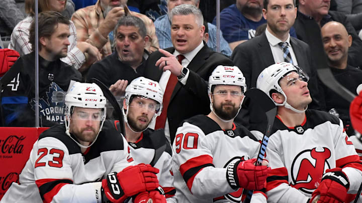 Jan 16, 2025; Toronto, Ontario, CAN;  New Jersey Devils head coach Sheldon Keefe gestures as he speaks to his players in the first period against the Toronto Maple Leafs at Scotiabank Arena. Mandatory Credit: Dan Hamilton-Imagn Images