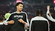 Dec 13, 2024; Portland, Oregon, USA; San Antonio Spurs center Victor Wembanyama (1) greets teammates during pregame announcements against the Portland Trail Blazers at Moda Center.