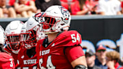 Sep 6, 2025; Raleigh, North Carolina, USA; North Carolina State Wolfpack huddle during the first half of the game against Virginia Cavaliers at Carter-Finley Stadium. Mandatory Credit: Jaylynn Nash-Imagn Images