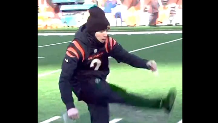 A Cincinnati Bengals fan attempts a field goal kick. A Cincinnati Bengals fan attempts a field goal kick.